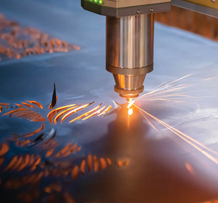 Laser cutting through metal
