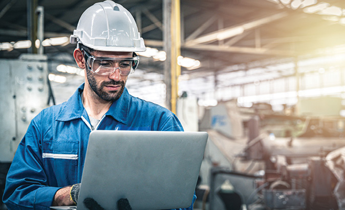 Health and safety officer checks measurement data on the computer